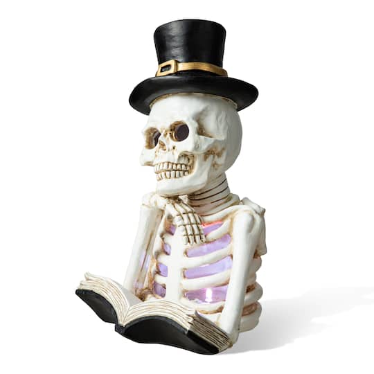 Glitzhome® 10" Lighted Halloween Resin Skull Reading Book Table Décor | 6" x 10.25" | Michaels®
